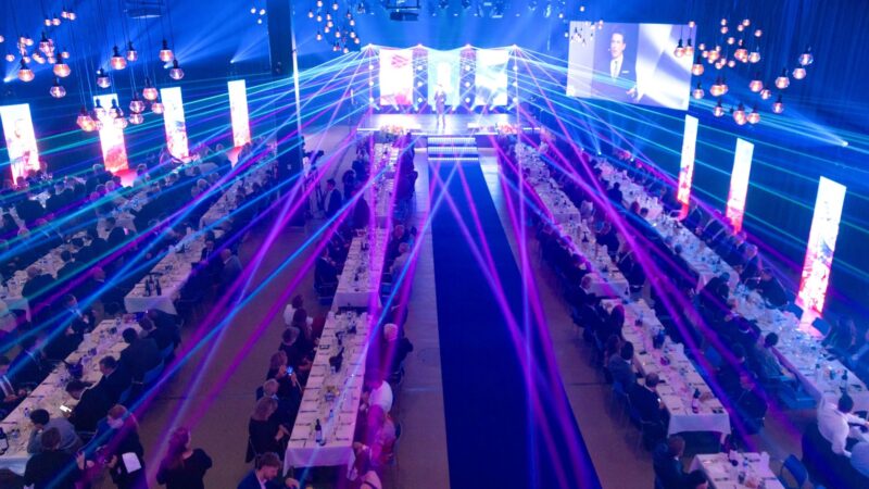 Gala dinner setting with long tables at Park Hall in Tampere Hall